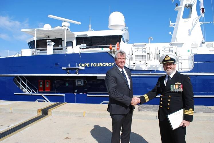 Gordon Blaauw, Austal Head of Design congratulates Commander Mark Taylor, Commanding Officer of ADV Cape Fourcroy at HMAS STIRLING, Western Australia. (Photo: Austal)