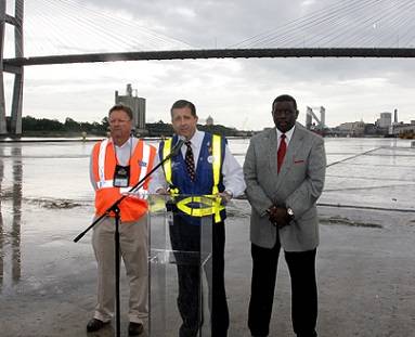 In a news conference, Georgia Ports Authority Executive Director Curtis Foltz, center,  joined by Ricky DeLoach, left, president of Local #1475 Clerks and Checkers Union, and Willie Seymore, president of Local #1414 Longshoremen's Union, both affiliates of the International Longshoremen's Association.