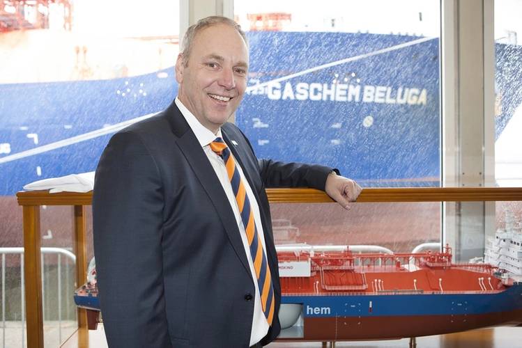 John Bruijnooge, Site Director of SABIC UK Petrochemicals, with a model of GasChem Beluga and, in the background, the innovative new eco-friendly vessel that will deliver ethane from Houston. (Photo: SABIC)