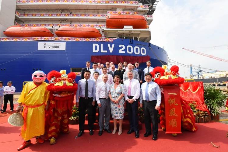 Leaders from McDermott International and Keppel are joined by the vessel's lady sponsor and celebrants during the naming ceremony of the DLV 2000, a high-specification deepwater derrick lay vessel at the Keppel Singmarine Shipyard. (Photo: McDermott)