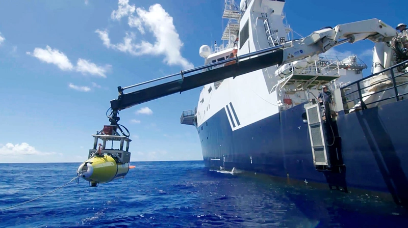 The AUV is lowered into the Philippine Sea in search of the USS Indianapolis. (Photo courtesy of Paul G. Allen)