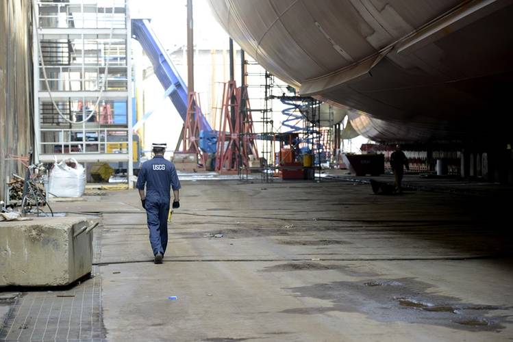 Lt. j.g. Ryan Thomas, a marine Inspector at Coast Guard Sector Delaware Bay, walks below the Kaimana Hila, an 850-foot container ship being constructed in Philadelphia Shipyards, Oct. 4, 2018. The Kaimana Hila and the Daniel K. Inouye are the two largest containerships ever built in the U.S. (Coast Guard photo by Seth Johnson)