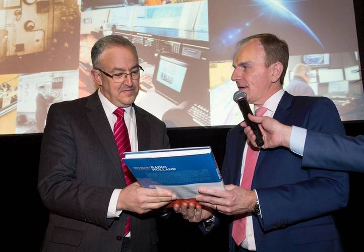 Mayor of Rotterdam Ing. A. Aboutaleb on the left was presented with the first anniversary book A Century Radio Holland by Paul Smulders, CEO Radio Holland Group. (Image: Radio Holland)
