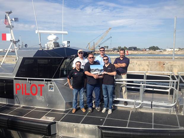 Metal Shark's director of sales Dean Jones presents the Canaveral Pilots Association with a plaque commemorating the delivery of the Association's new pilot boat. On hand to mark the occasion for the Pilots are business director Doug Mutter, director of engineering Mike Rigby, co-chairmen Ben Borgie and Doug Brown, and boat committee member Richard Grimson. (Photo: Metal Shark)