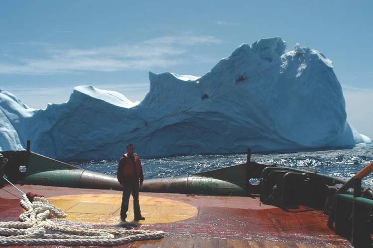 Mid-sized iceberg astern a vessel on the Grand Banks offshore Newfoundland. (Photo: C-Core)