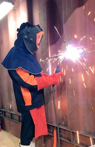 Minister Pyne welding his signature plate into the Hull of the first Pacific Patrol Boat (Image:Austal)