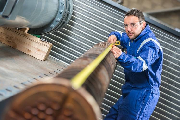 Engineering technician Craig Marr measures-up a heat exchanger at Ross Offshore's Peterseat Road facility.