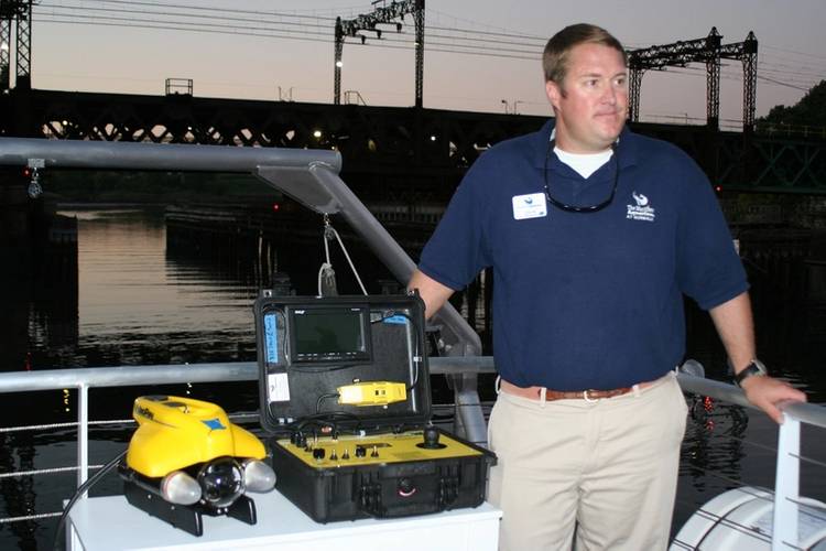 New research vessel for The Maritime Aquarium at Norwalk comes with an underwater ROV (Remotely Operated Vehicle) equipped with cameras that will allow students to explore the bottom of Long Island Sound, shipwrecks in the Sound and more. Shown with Aquarium Educator Colin Thom. (Photo courtesy of the Maritime Aquarium at Norwalk)