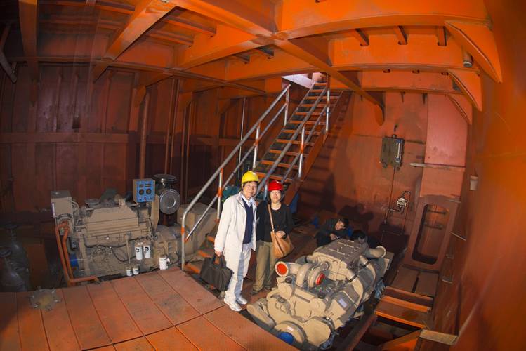 DongGuan Nanxiang Shipbuilding Liang Zhong De, Deputy General Manager, Guang Zhou Shun Fung Engineering Ltd. with Cummins’ Southern Manager Linda Zhang, in the starboard side engine room of the crane barge. The KTA19-D gen set is to the left and the KT38-m propulsion engine is to the right. (Haig-Brown photos courtesy of Cummins Marine)