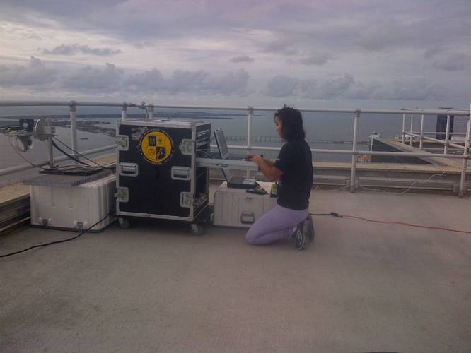 NRL's Blerta Bajramaj, Lead Engineer on the research team, operates the shore-side TREC node from the roof of the ground station. (Photo: U.S. Naval Research Laboratory)