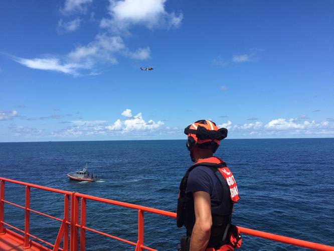Petty Officer 3rd Class Gage Hunt, a crewmember from Coast Guard Station Cortez, assists with the medevac of a 55-year-old man from the 550-foot tanker, Gaschem Stade, 13 miles west of Egmont Key, Florida, Monday, Aug. 14, 2017. An MH-60 Jayhawk helicopter air crew from Air Station Clearwater medevaced the 55-year-old man to Tampa General Hospital. (U.S. Coast Guard photo by Connor Sullivan)