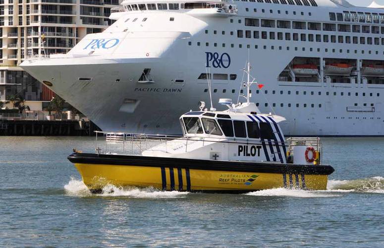 Pilot launch “MALU MAI” with Carnival Australia cruise ship Pacific Dawn in the background. Photo credit: Australian Reef Pilots Pty Ltd.