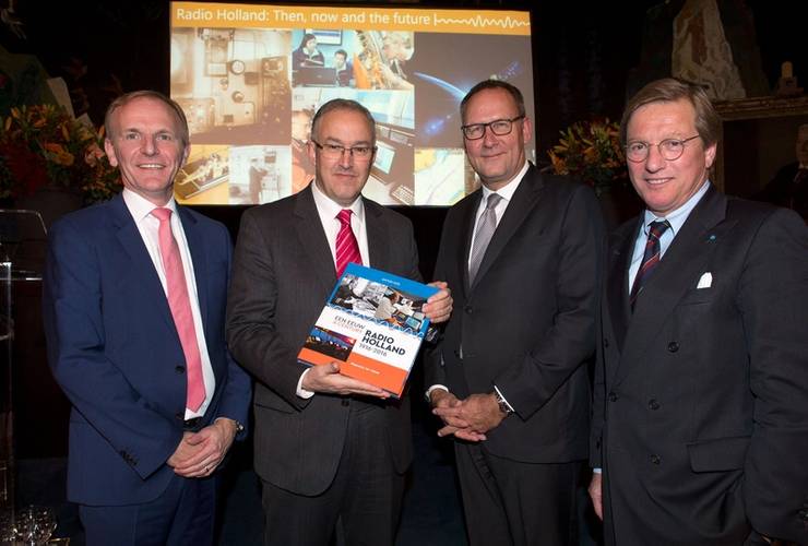 Presentation of the anniversary book A Century Radio Holland during the festive celebration of the 100th anniversary of Radio Holland on board of the ss Rotterdam. From left; Paul Smulders (CEO Radio Holland Group), Ing. A. Aboutaleb (Mayor of Rotterdam), Erik van der Noordaa (CEO RH Marine Group) and Ben Vree (Chairman of the supervisory board of RH Marine Group). (Photo: Radio Holland)