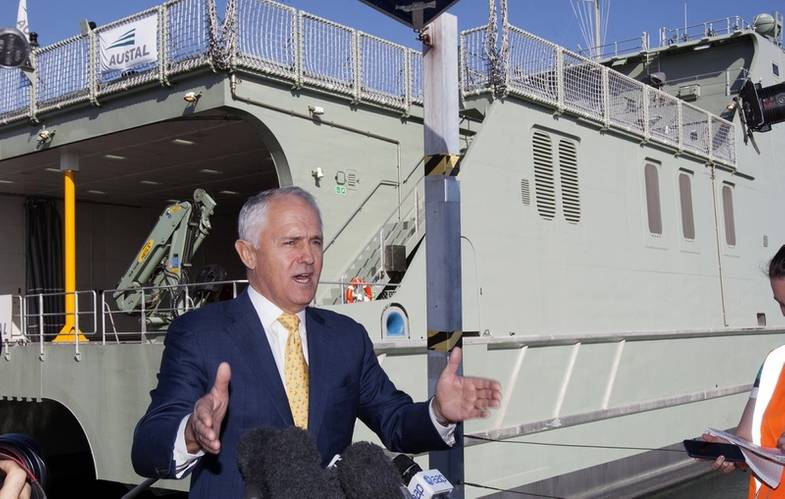 Prime Minister Malcolm Turnbull in front of the 72m (offshore patrol vessel sized) High Speed Support Vessel - designed and constructed for the Royal Navy of Oman by Austal. (Image: Rod Taylor/Austal)