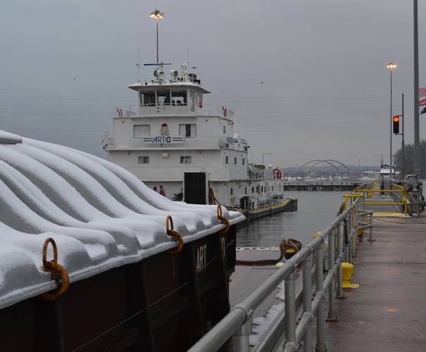 M/V New Dawn, pushing nine barges, marks the unofficial start to the navigation season for the Upper Mississippi River. (Photo by Pamela Niebur)
