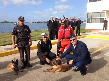 Rear Adm. Karl Schultz, commander of the 11th Coast Guard District, visits the Mexican Navy Second Naval Region’s K-9 unit where handlers demonstrated how the dogs carry out contraband detection Thursday, Dec. 5, 2013, in Ensenada, Mexico. The trip was in part of a joint two-day search and rescue exercise with members of the Mexican Navy. U.S. Coast Guard photo.
