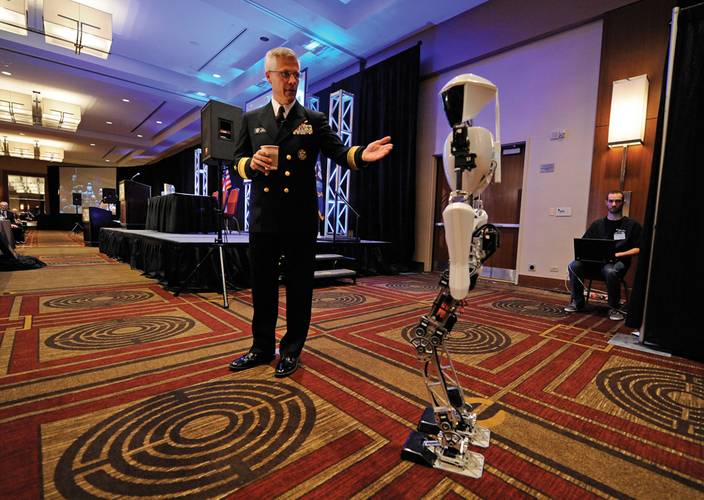 Rear Adm. Matthew L. Klunder, Chief of Naval Research, introduces CHARLI-2 from Virginia Tech’s Robotics & Mechanisms Laboratory during the Office of Naval Research (ONR) 2012 Science and Technology Partnership Conference. (U.S. Navy photo by John F. Williams)