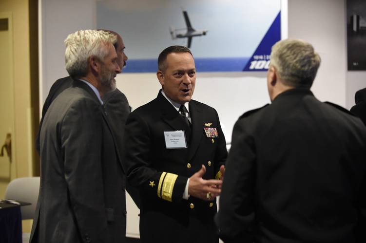 Rear Adm. Winter talks with exhibitors during the 28th annual Surface Navy Association (SNA) National Symposium. (U.S. Navy photo by John F. Williams)