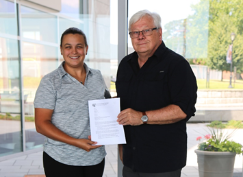 Rebecca Garcia-Malone, ASA Education Committee Chair, presents Dr. Richard J. Burke, ABS Professor of Naval Architecture & Engineering, SUNY Maritime College, with an official invitation to join the ASA as the very first honorary maritime faculty member representative, July 20, 2018 at SUNY Maritime College. (Photo: ASA)