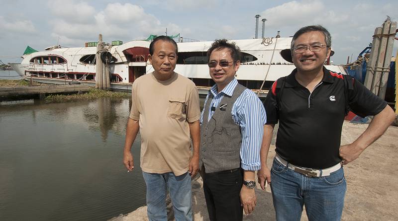 left to right: Sakchai Rujiphapra, Director, Mahachai Dockyard; Sathit Suwanprasert, Senior Engineer, Marketing Dept., Cummins DKSH (Thailand) and Ku Wee Ming, Manager, Regional Marketing, Cummins Asia Pacific with the newly launched Wonderful Pearl currently being fitted out alongside at the shipyard. (Haig-Brown photo courtesy of Cummins Marine)