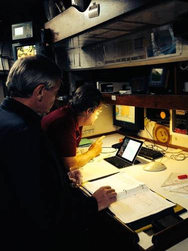 Robert Scott, ARES Security Corporation, and Pride of Baltimore's Captain Jan Miles in Pride of Baltimore's navigation center reviewing CommandPost capabilities. (PRNewsFoto/The Mariner Group)