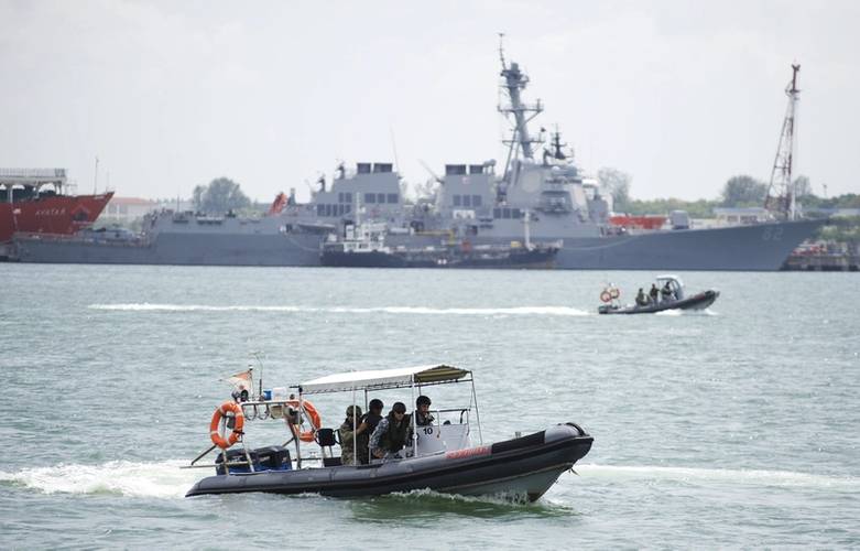 Sailors assigned to Coastal Riverine Squadron 3 and members of the Republic of Singapore navy exchange visit, board, search and seizure techniques during Cooperation Afloat Readiness and Training (CARAT) Singapore 2015. (US Navy photo by Gregory A. Harden II)