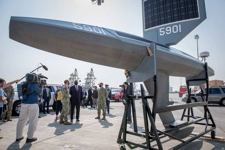 Secretary of Defense Lloyd J. Austin speaks to U.S. Navy personnel about the Saildrone Explorer unmanned surface vessel, attached to Task Force (TF) 59, at Naval Support Activity Bahrain, Nov. 21. TF 59 is the first U.S. Navy task force of its kind, designed to rapidly integrate unmanned systems and artificial intelligence with maritime operations in the U.S. 5th Fleet area of operations. (Photo: Mark Thomas Mahmod / U.S. Navy)