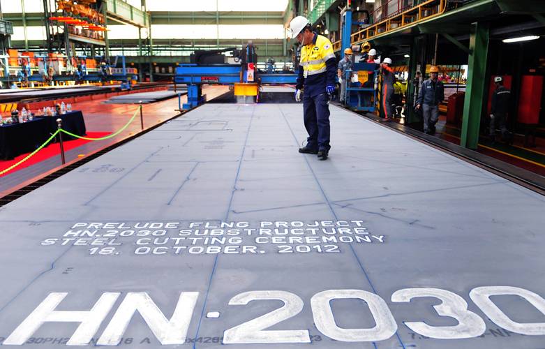 Shell celebrates the first steel cut for the first steel cut for the game-changing Prelude floating liquefied natural gas project’s substructure. The sheet of steel to be cut weighs 7.6 tonnes, is 4.3 metres wide, 13.8 metres long and 16.5 millimetres thick. (Photo: Shell)   