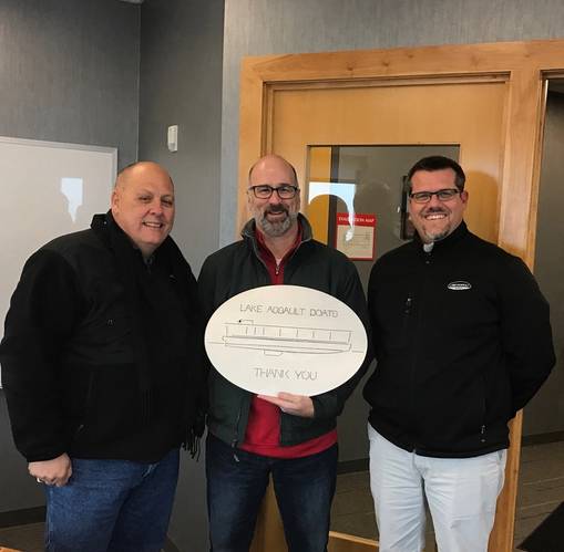 Shortly after hitting the “go” button to signify the beginning of production for 43 river barges for the City of San Antonio, a plaque was presented by Lake Assault Boats to representatives from the city. Pictured (left to right) Jim Mery, Deputy Director for the City of San Antonio; John Jacks, Interim Director for the City of San Antonio; and Chad DuMars, Lake Assault Boats Vice President of Operations. (Photo: Lake Assault Boats)