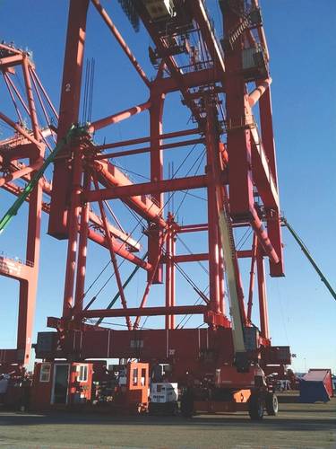 Six ZPMC STS container cranes have been raised for Total Terminals International at the company’s Long Beach, California terminal using moving and lifting systems from Nordholm Rentals. (Photo courtesy of Nordholm Rentals)