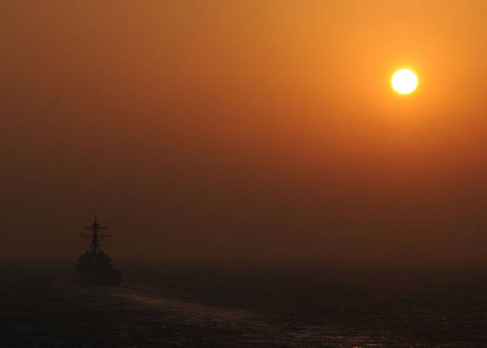 STRAIT OF HORMUZ (Oct. 12, 2012) The guided-missile destroyer USS Jason Dunham (DDG 109) is underway in the Strait of Hormuz at sunset, while deployed in support of maritime security operations and theater security cooperation efforts in the U.S. 5th Fleet area of responsibility. (U.S. Navy photo by Mass Communication Specialist 2nd Class Zane Ecklund)