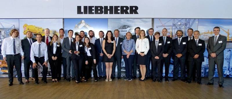 Staff from Liebherr Argentina celebrating the opening of the Buenos Aires subsidiary with members of the Liebherr family (Photo: Liebherr)