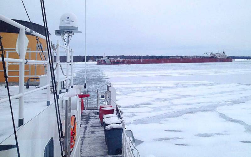 The Coast Guard Cutter Biscayne Bay provides a direct assist to the motor vessel Presque Isle, which was stuck in ice just below Winter’s Point Turn on the St. Mary’s River, just south of Neebish Island on December 13, 2013. U.S. Coast Guard photo by Lt. j.g. Paul Junghans.