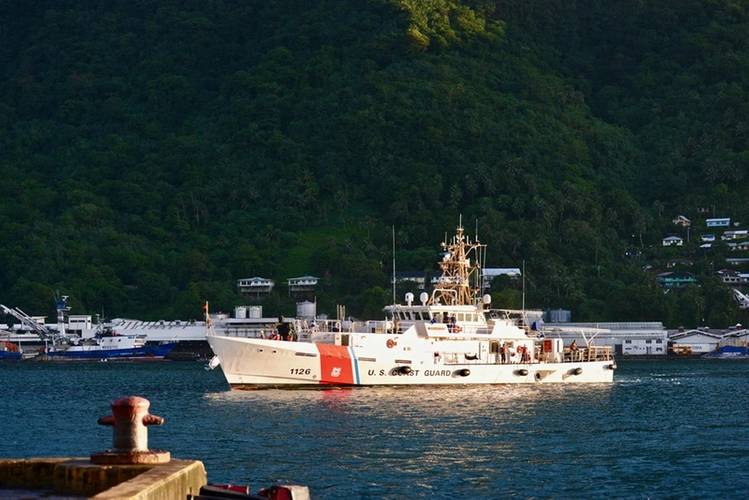 The crew of USCGC Joseph Gerczak (WPC 1126) prepare to moor at the port of Pago Pago, American Samoa, Aug. 3, 2019. They will conduct a joint fisheries patrol with NOAA Fisheries and American Samoa Marine Police members. (U.S. Coast Guard photo by Chief Petty Officer Sara Muir/Released)
