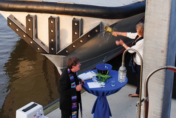 The magic moment … Anne Smith, wife of longtime Charleston Branch Pilots’ President Whit Smith, christens the M/V “FORT RIPLEY”