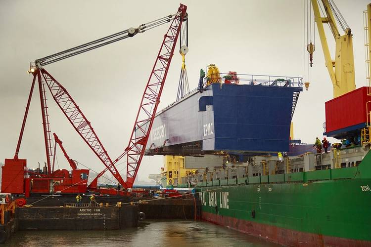 The main girder of Vancouver Shipyard’s new 300-metric-tonne Gantry Crane offloading at Fraser Surrey Docks on Saturday, February 15, 2014