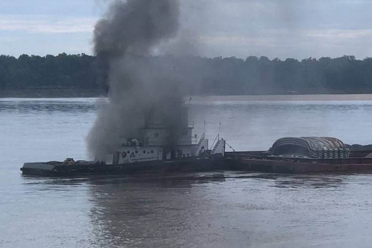The vessel Jacob Kyle Rusthoven caught fire on the lower Mississippi River near West Helena, Ark., on September 12. (U.S. Coast Guard photo by Brandon Giles)