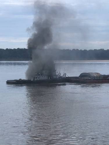 The vessel Jacob Kyle Rusthoven caught fire on the lower Mississippi River near West Helena, Ark., on September 12. (U.S. Coast Guard photo by Brandon Giles)