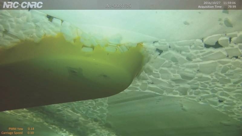 Underwater cameras show a model ship traveling through ice in the ice tank. (Photo: National Research Council of Canada)