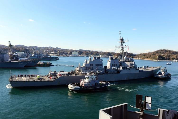 USS John S. McCain is towed to a pier at Fleet Activities (FLEACT) Yokosuka. (U. S. Navy photo by Leonard Adams Jr.)