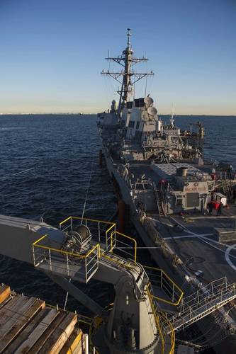 USS John S. McCain is towed by the heavy lift transport MV Treasure. (U. S. Navy photo by Joshua B. Mortensen)