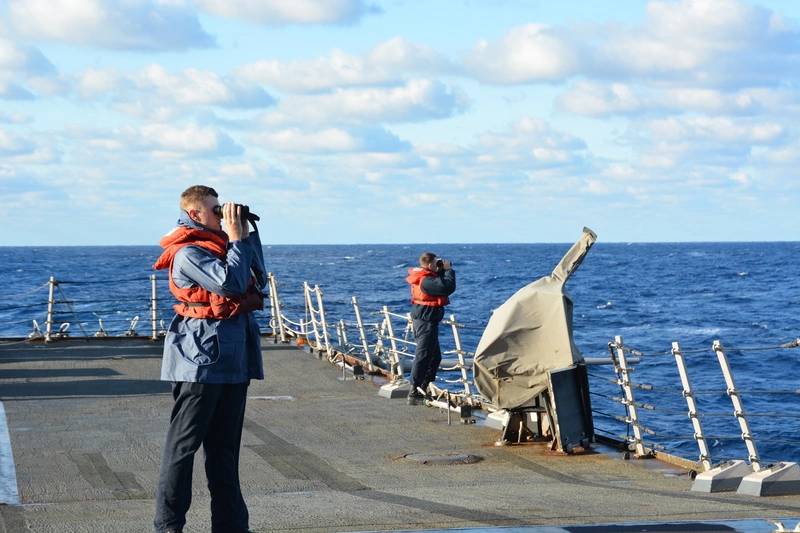 Sailors aboard the guided-missile