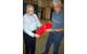 Chuck Ryerson and Len Zabilansky at the lab. They are holding a 3-D printed test article for understanding the effects of frazil ice in a water jet propulsion system.