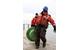 Coast Guard Petty Officer 2nd Class Brandon Cummings, an electrician mate at Coast Guard Station Portage, Mich., hauls a buoy along the stations pier, Nov. 14, 2013. One of the station's missions is aids to navigation. (U.S. Coast Guard photo by Petty Officer 1st Class Thomas Johnson)