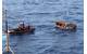 A Coast Guard Cutter Dauntless smallboat crew interdicts 25 Cuban migrants aboard a rustic vessel southwest of Key West, Florida, Sep. 6, 2011. The migrants were later repatriated by the crew aboard the Coast Guard Cutter Knight Island. U.S. Coast Guard photo.