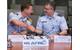 U.S. Coast Guard Capt. Greg Rothrock, Coast Guard Research and Development Center commanding officer, and Air Force Maj. Gen. William Cooley, Air Force Research Laboratory commander, shake hands April 12, 2018, at Wright-Patterson Air Force Base, Ohio, after they signed a memorandum of understand between their two organizations. The agreement allows USCG RDC and AFRL to work together on tasks of mutual benefit. (U.S. Air Force photo by R.J. Oriez)