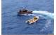 The Cutter Dauntless smallboat crew inspects a rustic vessel used by 20 Cuban migrants south of Dry Tortugas, Florida, Sep. 6, 2014. The migrants were later repatriated by the crew aboard the Coast Guard Cutter Knight Island. U.S. Coast Guard photo.
