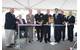 Cutting the ribbon, from left, Dominic Galluci, P&S Construction; RI Congressman James Langevin; RI Governor Lincoln Chafee; Rear Adm. Michael Jabaley, commander, NUWC; Capt. Todd Cramer, commander, NUWC Division Newport; Mark Rodrigues, head NUWC's Platform and Payload Integration Department; Blair Decker, General Dynamics/Electric Boat; and RI Senator Jack Reed.