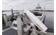 
An example of a charging arm mounted on a platform near the terminal. Once a vessel is secured at the dock, the arm connects, delivers power, and disconnects before departure. Image courtesy Washington State DOT
