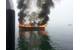 Fishing vessel Bigger Dirls on fire in Hopkins Point Marina in Jonesport, Maine (U.S. Coast Guard photo by Stephanie Horvat)